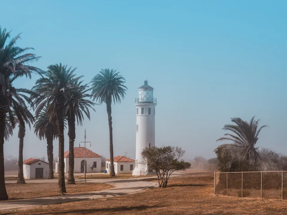 White lighthouse among palm trees at Palos Verdes